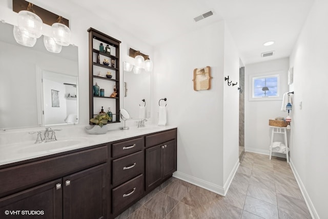 bathroom with vanity and a shower