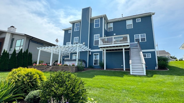 rear view of house with a pergola and a yard