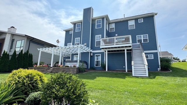 rear view of house featuring a jacuzzi, a pergola, a deck, and a lawn