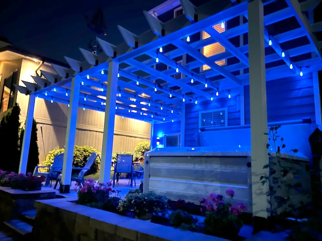 patio at night with a pergola