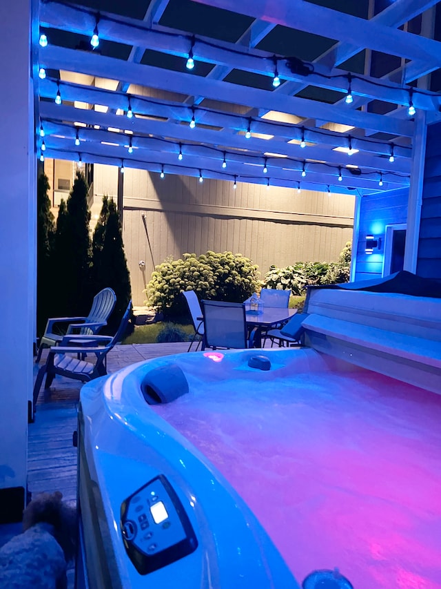 view of patio featuring a hot tub and a pergola