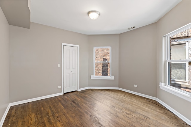 empty room featuring hardwood / wood-style floors