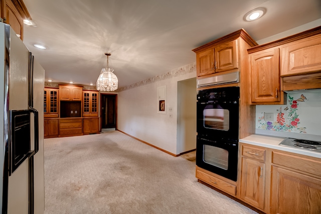 kitchen with stainless steel appliances, decorative light fixtures, light colored carpet, a notable chandelier, and custom range hood