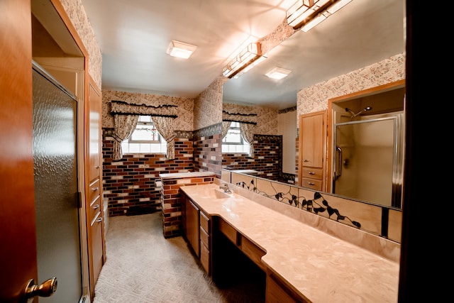 bathroom with tile patterned flooring, a shower with shower door, tasteful backsplash, and vanity