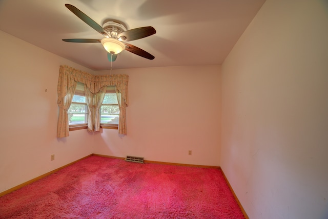 unfurnished room with carpet and ceiling fan