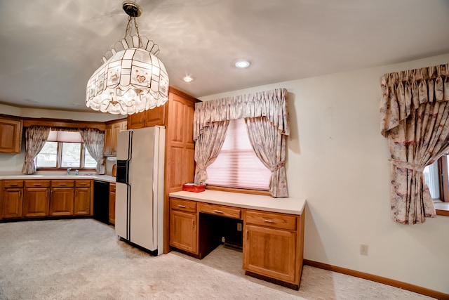 kitchen featuring black dishwasher, light colored carpet, hanging light fixtures, and white refrigerator with ice dispenser