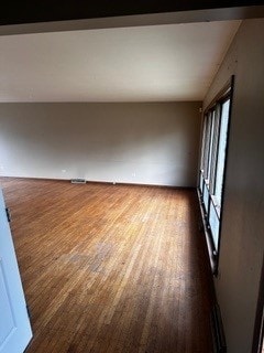 16631 Langley Ave, South Holland, IL 60473 - empty room featuring lofted ceiling and dark wood finished floors