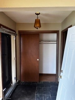 interior space featuring dark tile patterned flooring