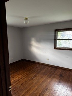 empty room with wood-type flooring