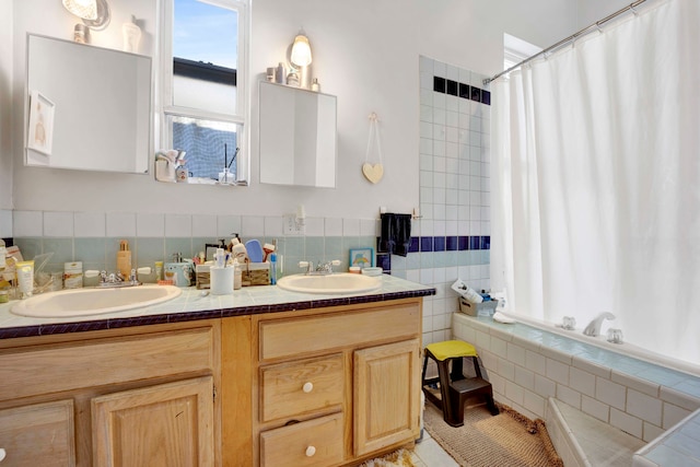 bathroom featuring tile patterned floors, vanity, shower / bathtub combination with curtain, and tile walls