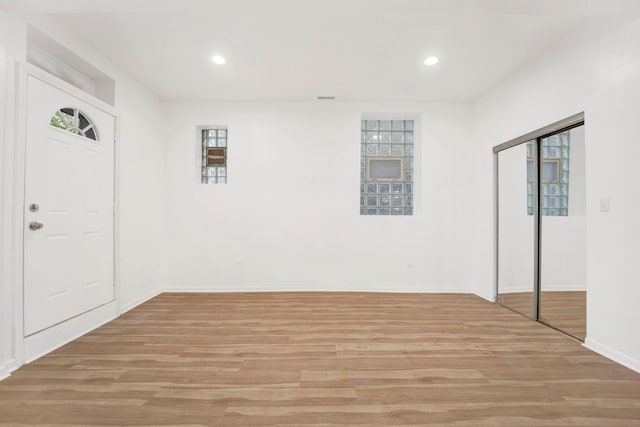 entryway with light hardwood / wood-style floors