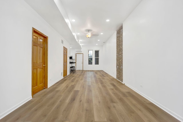 hallway with light wood-type flooring