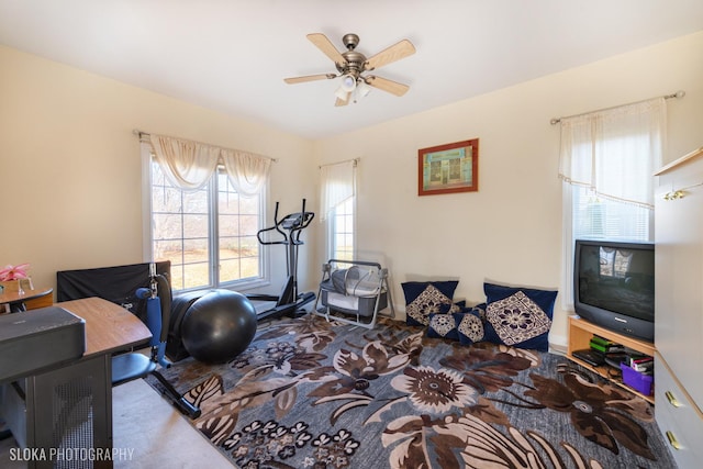 exercise room featuring ceiling fan