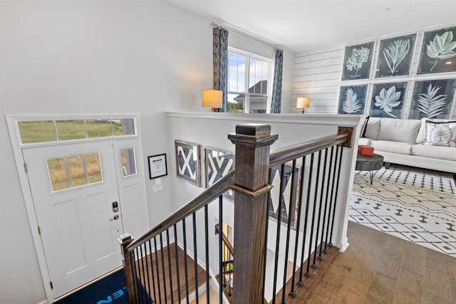 stairway featuring hardwood / wood-style flooring