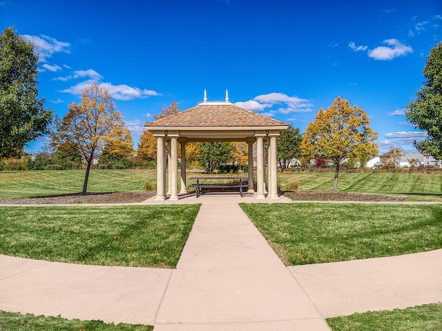 surrounding community with a gazebo and a lawn