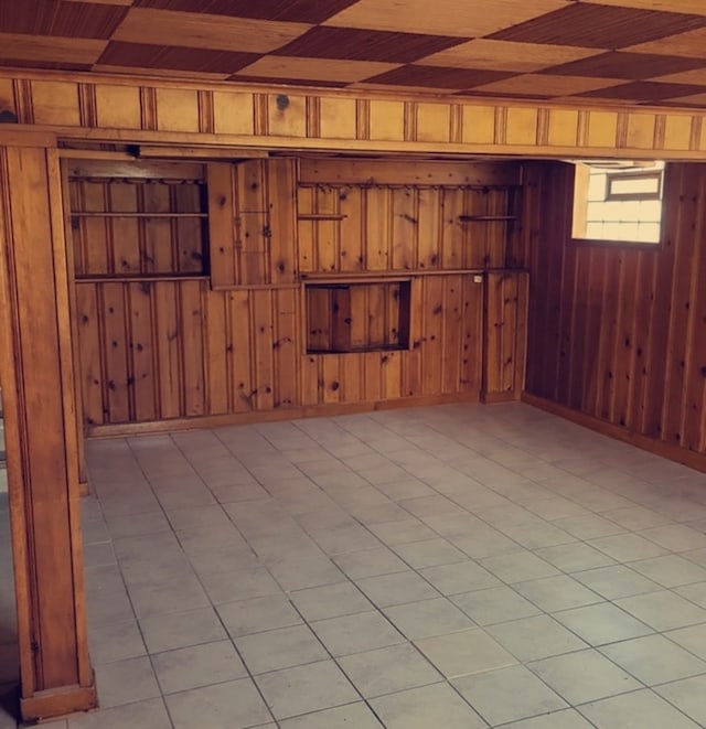 spare room featuring wood-type flooring and baseboard heating