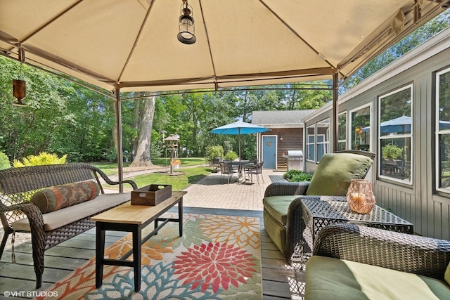 view of patio with a gazebo, a grill, and outdoor lounge area