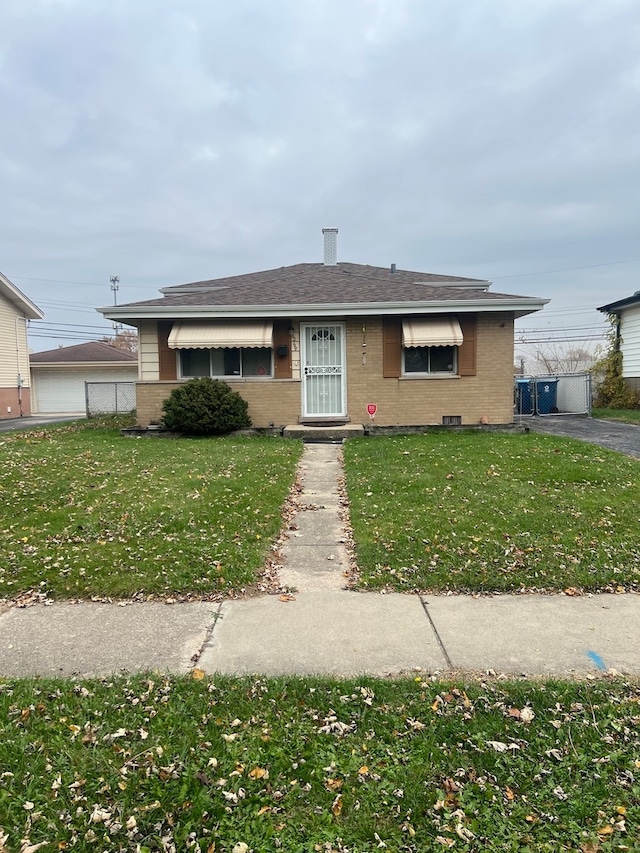 ranch-style home with a front yard