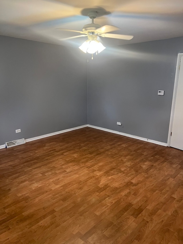 empty room featuring wood-type flooring and ceiling fan