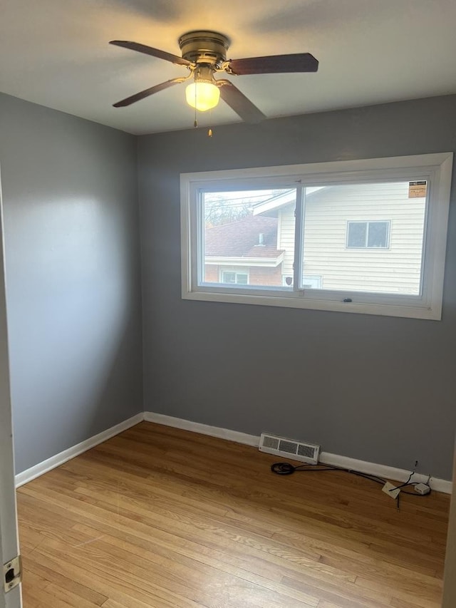 1269 Arthur St, Calumet City, IL 60409 - spare room featuring ceiling fan, baseboards, and light wood finished floors