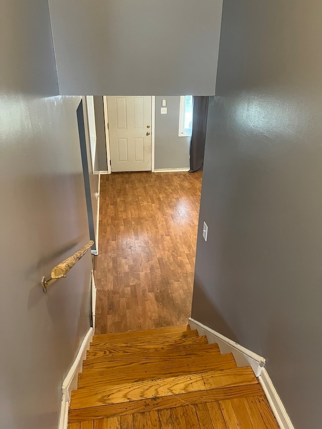 staircase featuring hardwood / wood-style flooring