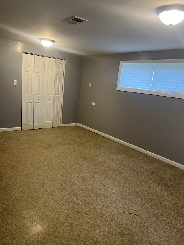 1269 Arthur St, Calumet City, IL 60409 - unfurnished bedroom with a closet, baseboards, and carpet