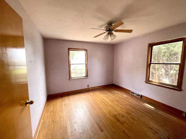 unfurnished room featuring ceiling fan and light hardwood / wood-style floors