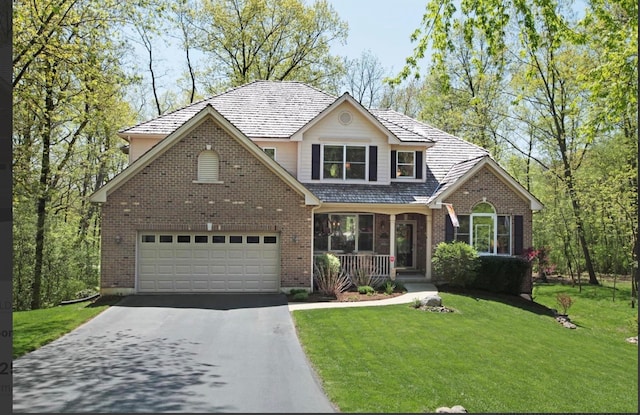 front facade featuring a garage and a front lawn