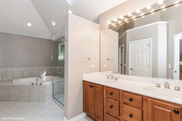 bathroom with double vanity, plus walk in shower, tile patterned flooring, and vaulted ceiling