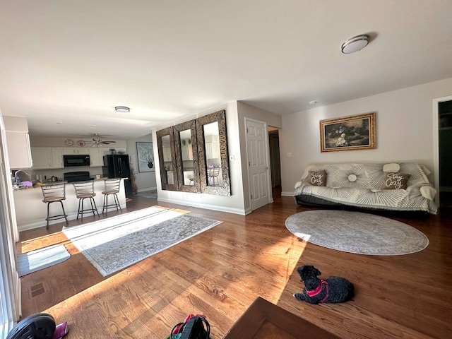 interior space featuring ceiling fan and hardwood / wood-style floors