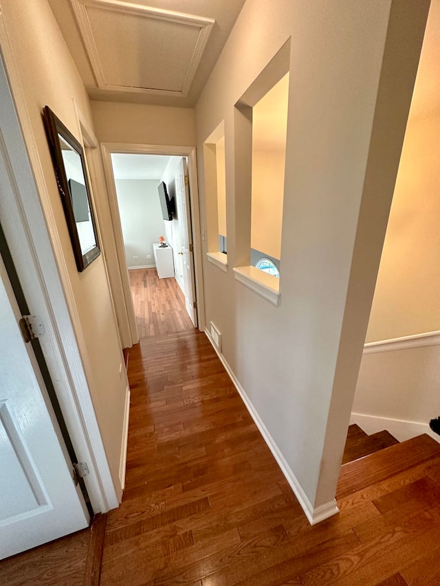 hallway with dark hardwood / wood-style floors