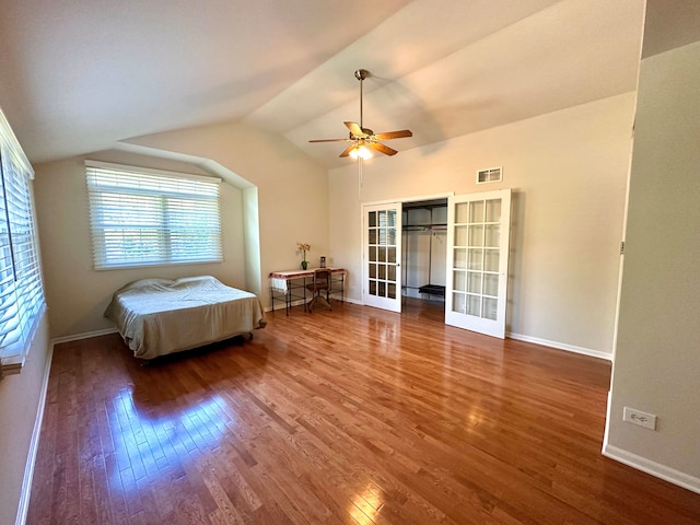 bedroom featuring ceiling fan, vaulted ceiling, and hardwood / wood-style floors