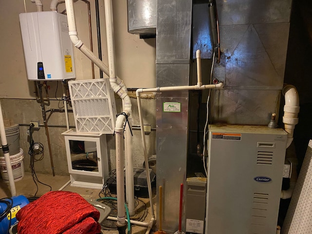 utility room featuring tankless water heater