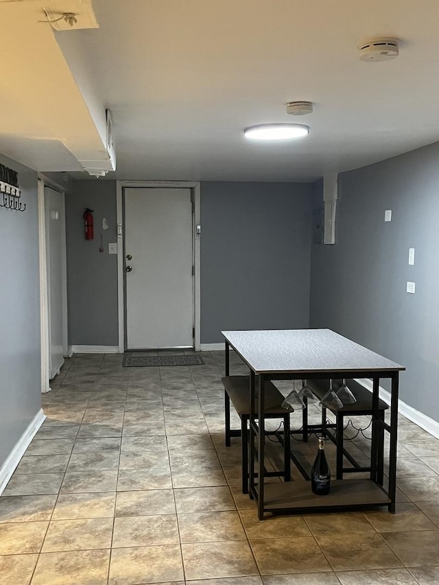 dining space with tile patterned flooring