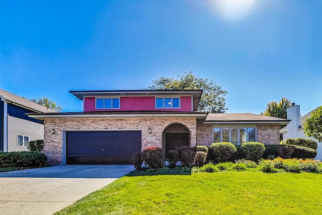 view of front facade with a front lawn and a garage