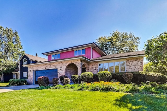 split level home featuring a garage and a front yard