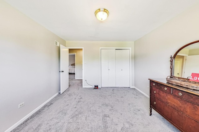 carpeted bedroom featuring a closet