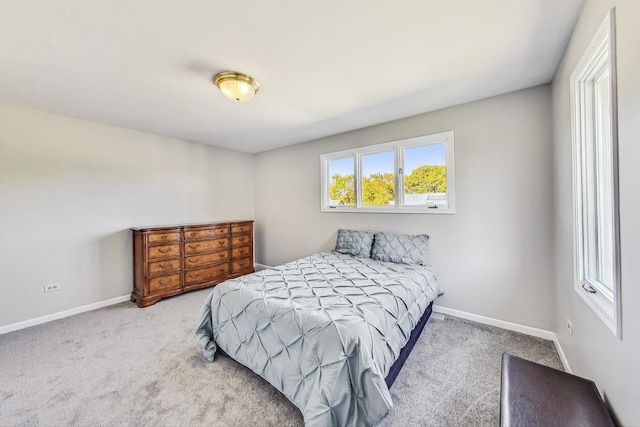 bedroom with light carpet