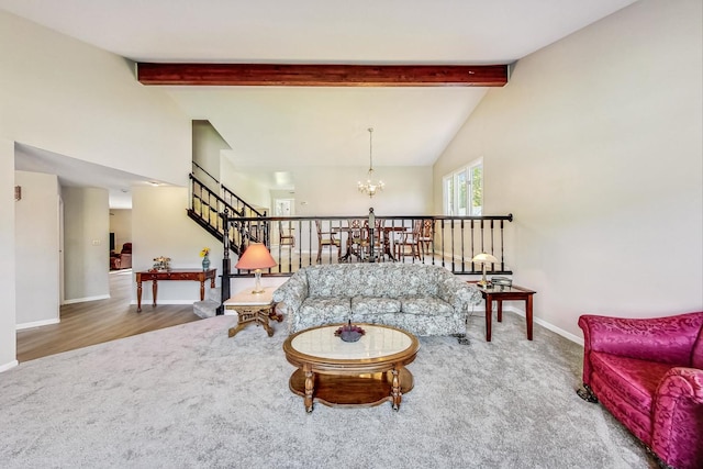 living room featuring wood-type flooring, lofted ceiling with beams, and an inviting chandelier