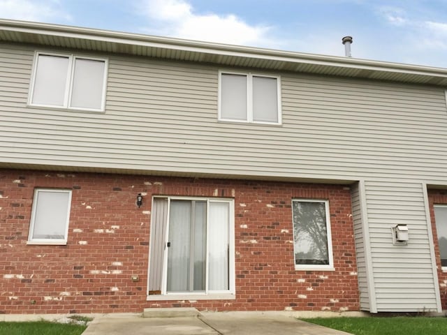 rear view of property with a patio area