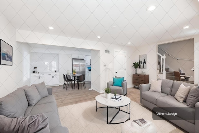 living room featuring tile walls and light tile patterned floors