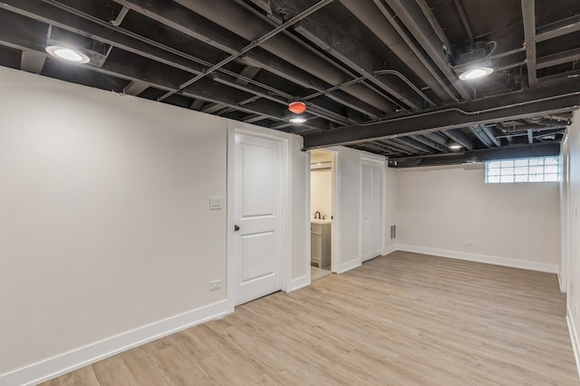 basement featuring wood-type flooring