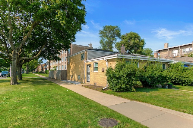 view of home's exterior with a lawn