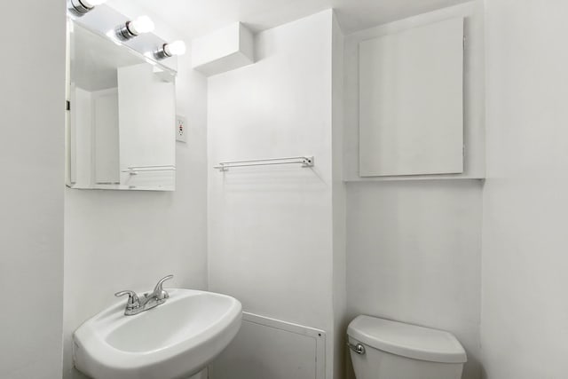 bathroom with sink and toilet