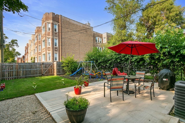 view of patio / terrace featuring a playground and cooling unit