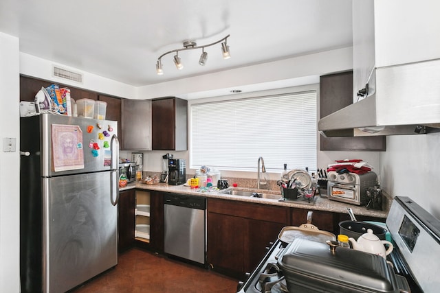 kitchen featuring sink, wall chimney range hood, appliances with stainless steel finishes, and dark brown cabinets