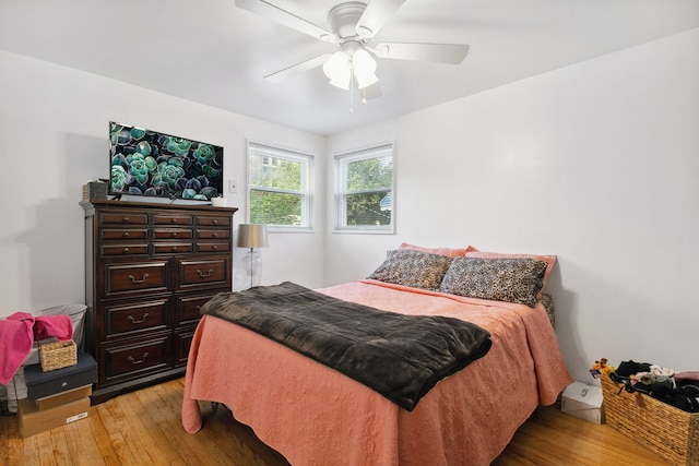 bedroom featuring ceiling fan and light hardwood / wood-style floors