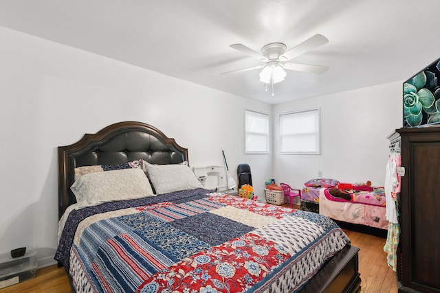 bedroom featuring ceiling fan and light hardwood / wood-style floors