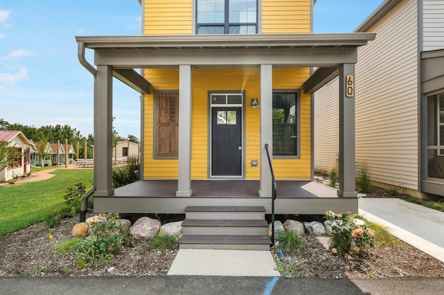 entrance to property with covered porch