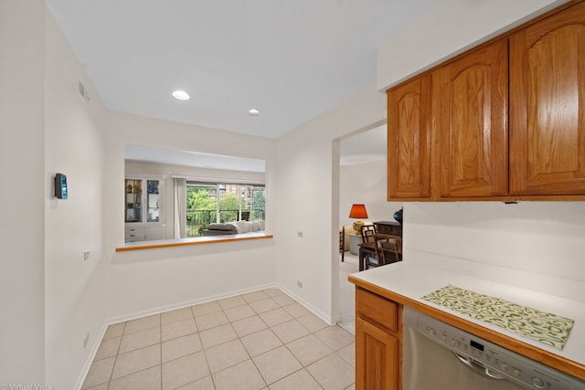 kitchen with dishwasher and light tile patterned floors